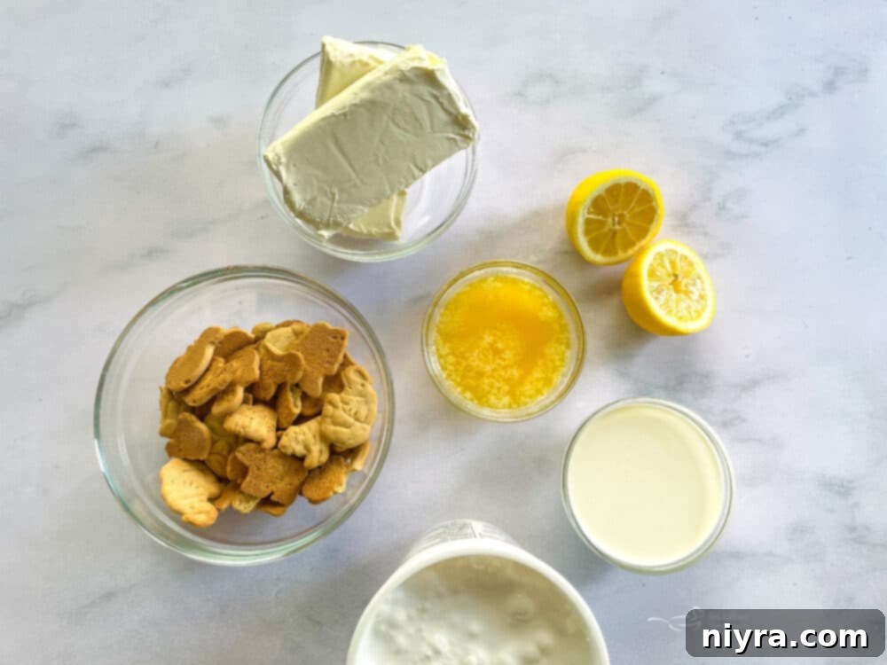 Ingredients for No-Bake Marshmallow Cheesecake laid out on a table.