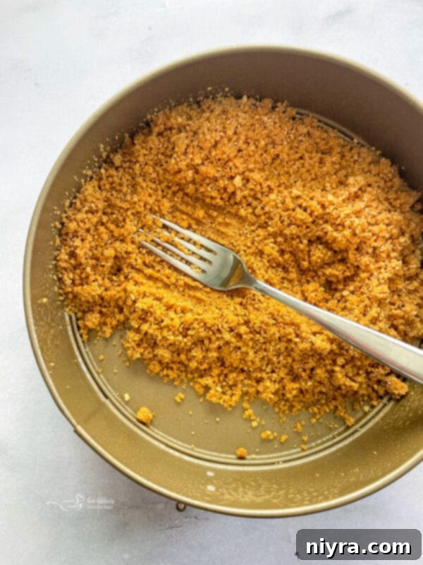 Animal Cracker Crust pressed firmly into a springform pan.