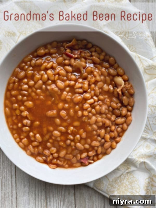 Overhead shot of Grandma's Baked Beans in a white serving dish.