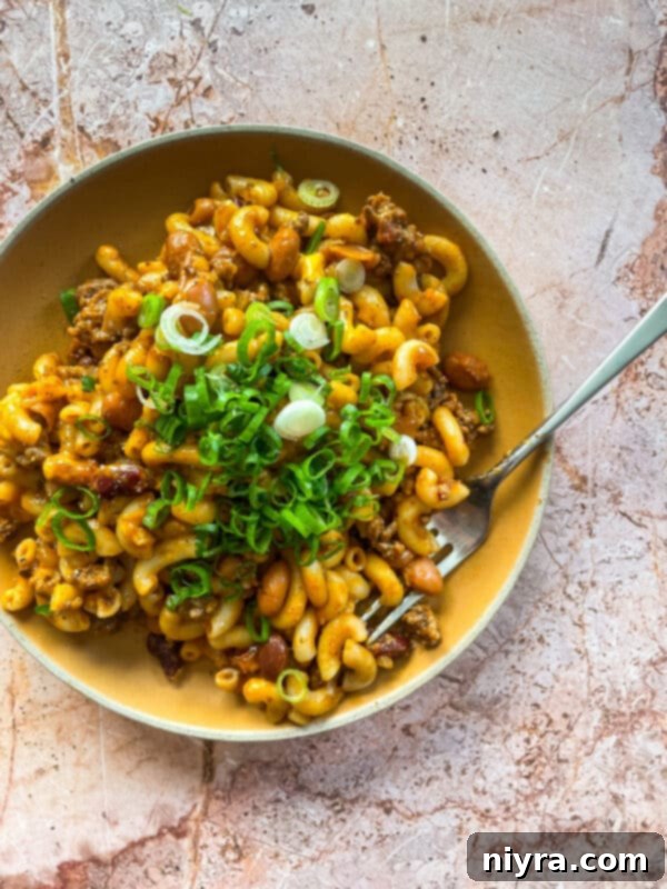 Chili Mac Skillet in a bowl, with a fork