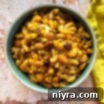 Chili Mac in a bowl with a yellow napkin along the side