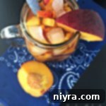 overhead of tea in a pitcher with text "{Anti} Prohibition Peach Tea"