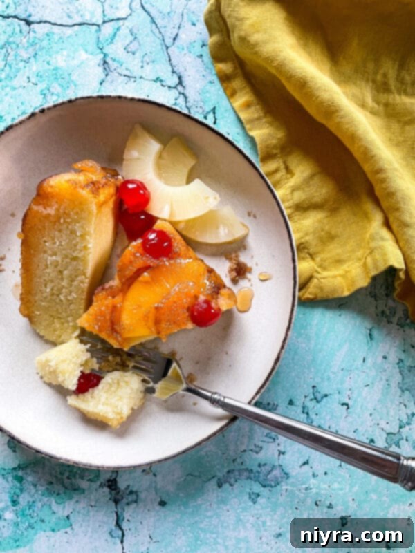 Homemade Pineapple Upside Down Cake 20 Slice of Pineapple Upside Down Cake on a plate