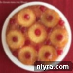 Homemade Pineapple Upside Down Cake 24 Overhead of From Scratch Pineapple Upside Down Cake on a white plate