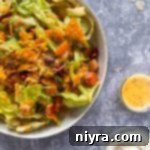 Aunt Sue's Ultimate Doritos Taco Salad 16 Extreme close up of Sue's Doritos Taco Salad in a white bowl.