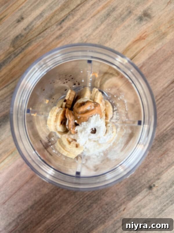 Close-up of frozen banana slices on a plate, ready for blending.