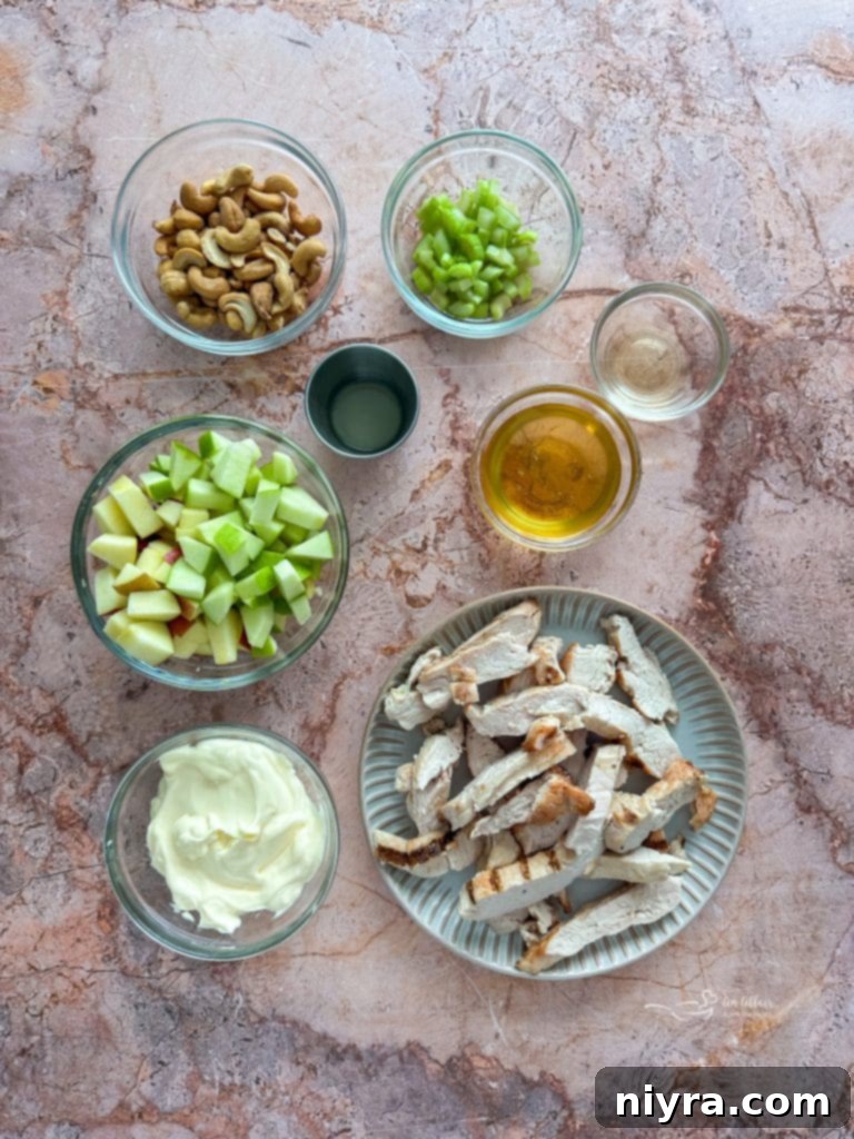 A bowl filled with the prepared creamy honey dressing for the chicken salad, showing its smooth texture.