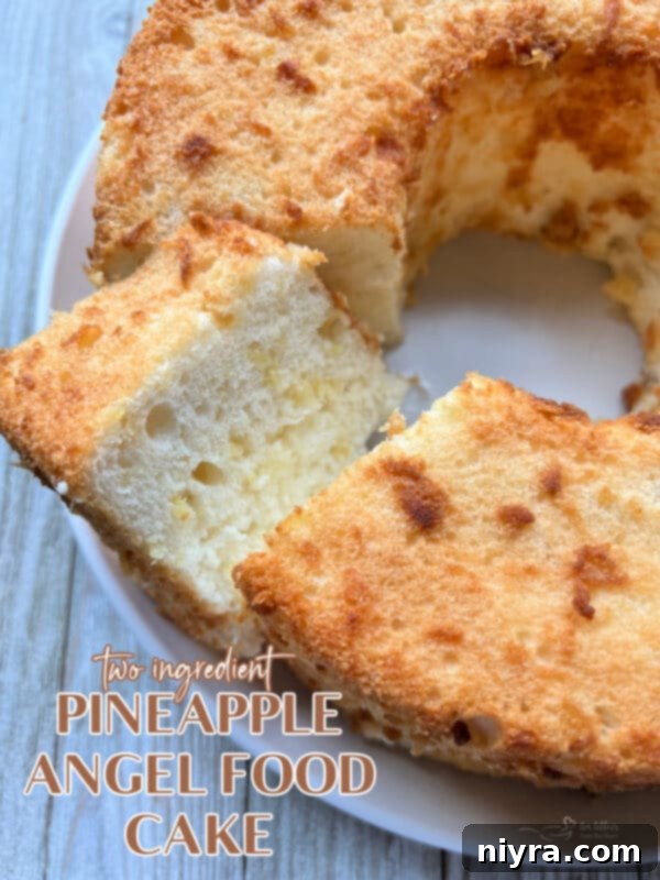 Hero shot of the Pineapple Angel Food Cake, whole, on a serving platter
