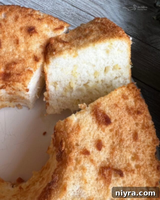 Angel Food Cake mix box next to an open can of crushed pineapple