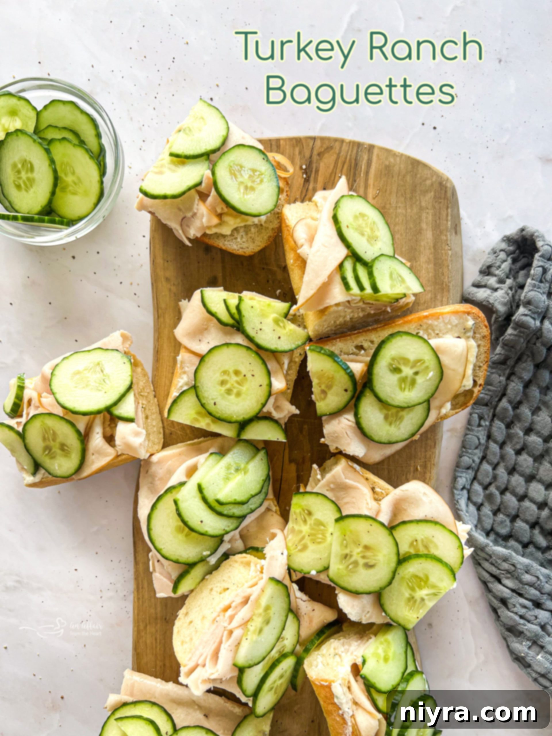A stunning hero shot of a large Turkey Ranch Baguette, beautifully arranged.