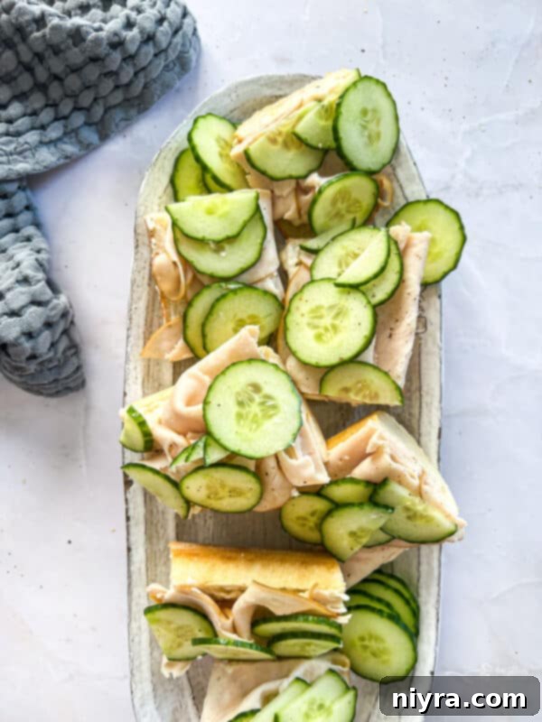 Two halves of a freshly made Turkey Ranch Baguette, ready to be sliced.