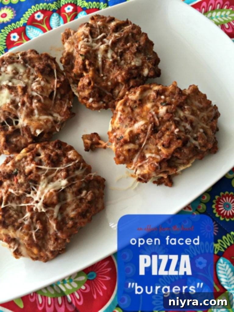 Pizza Burger Melts 13 A top-down view of Open-Faced Pizza Burgers arranged on a rustic wooden board