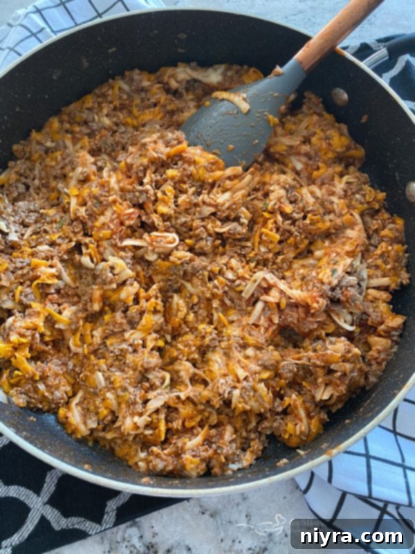 Pizza Burger Melts 5 Cooked ground beef and onion mixture in a skillet, ready for cheese and pizza sauce