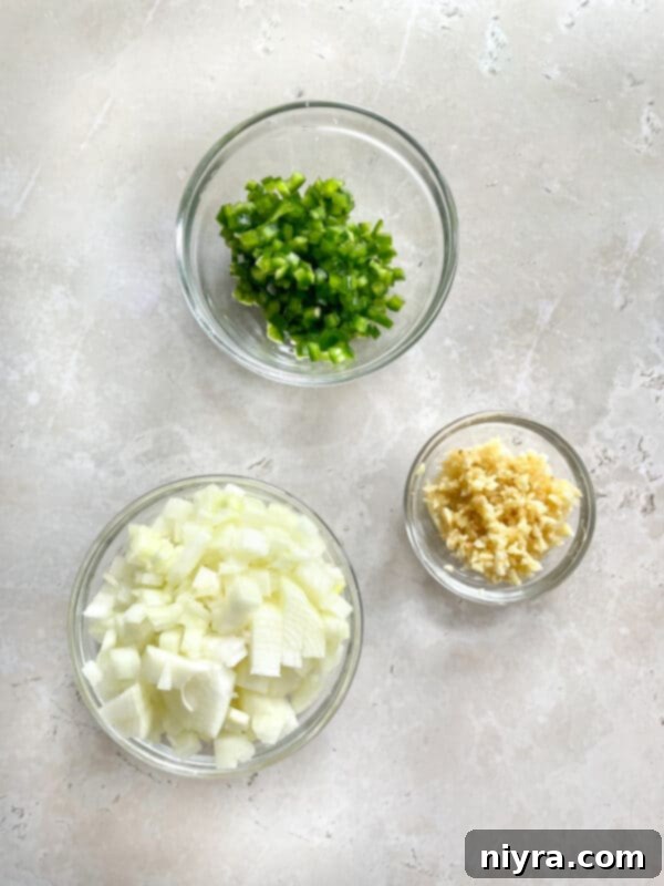 Ingredients for slow cooker carnitas laid out on a cutting board