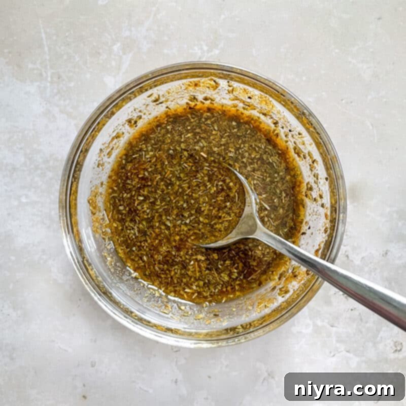 Pork roast being prepared for slow cooking, with spices and aromatics