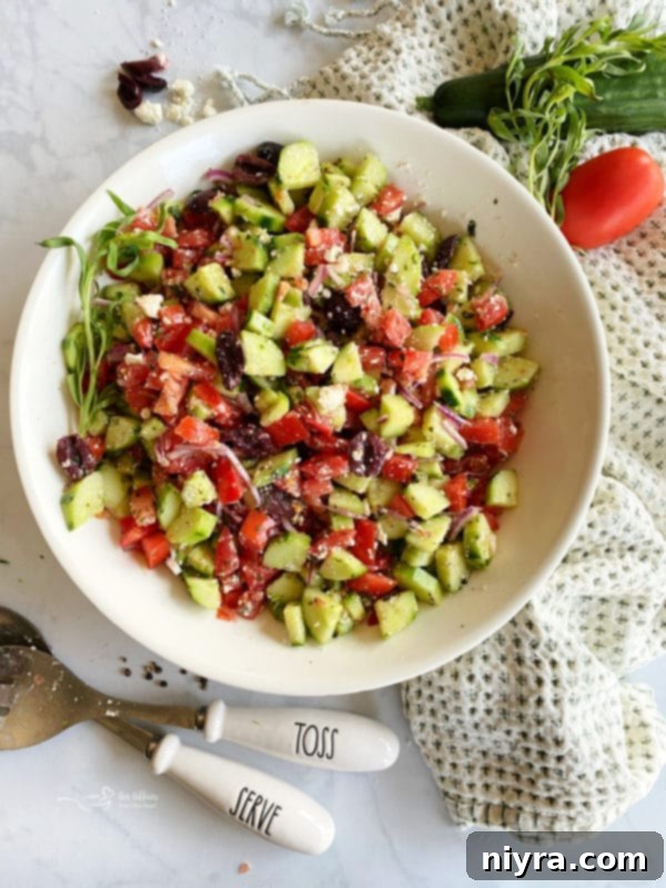 Refreshing Greek Cucumber Salad 2 White bowl filled with Greek style cucumber salad