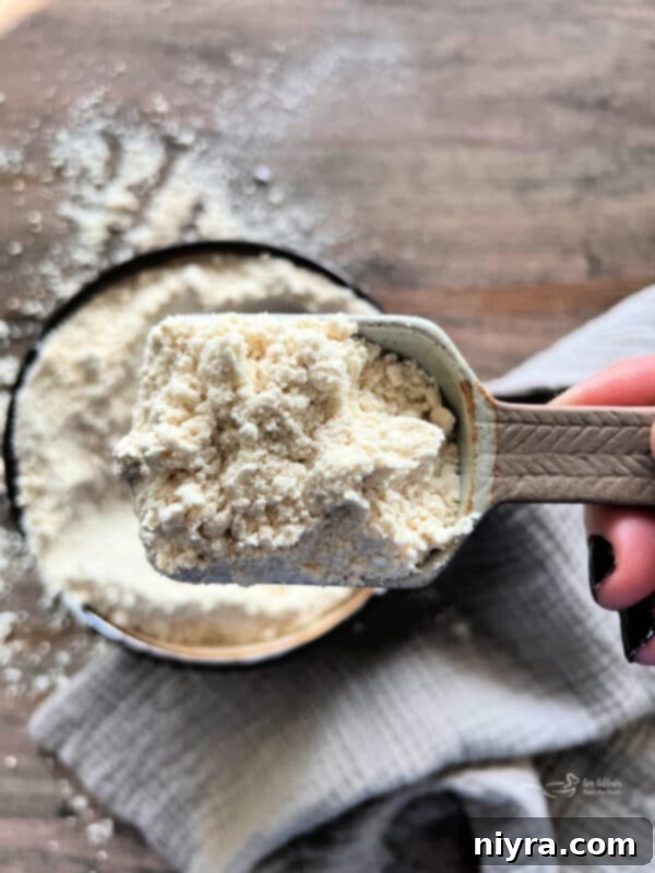 A measuring cup filled with homemade bisquick mix