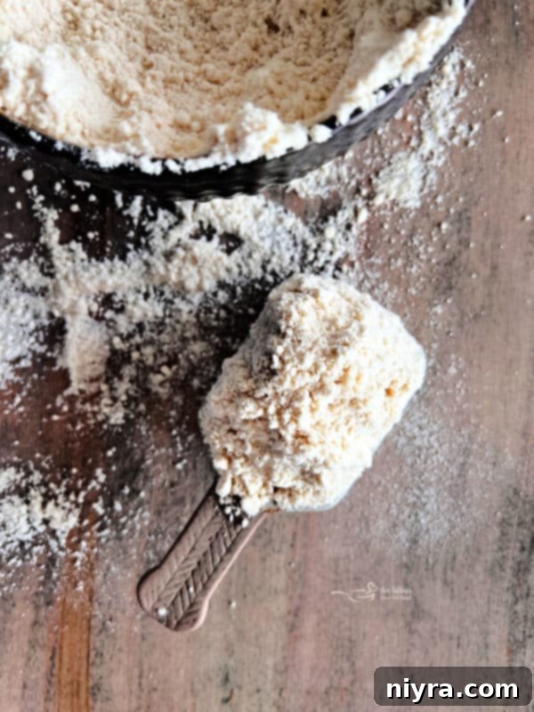 Homemade Bisquick Mix ingredients in separate bowls on a wooden board