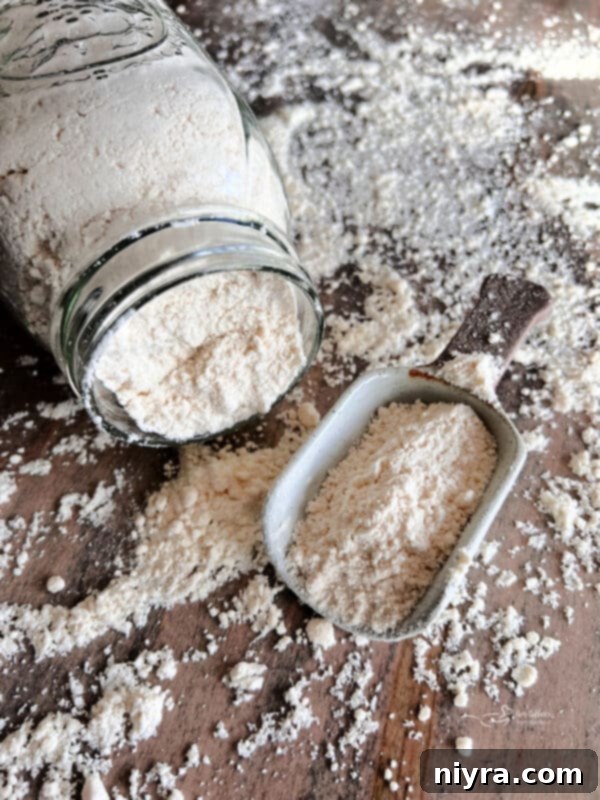 A bowl of homemade bisquick mix with a whisk