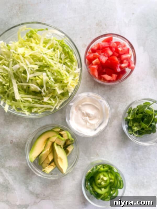 Various taco toppings laid out on a table