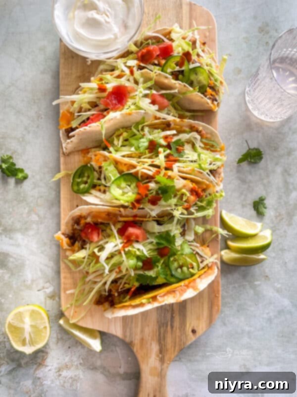 Two Baked Double Decker Tacos on a white plate