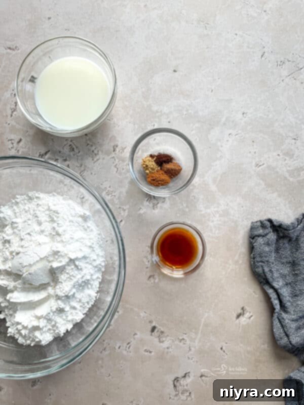 Ingredients for Spiced Donut Glaze, including powdered sugar, milk, vanilla extract, and spices