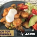 Loaded Tater Tot Taco Bake 12 Overhead shot of the full baked Taco Tot Casserole, adorned with fresh cilantro, ready to be dished out.