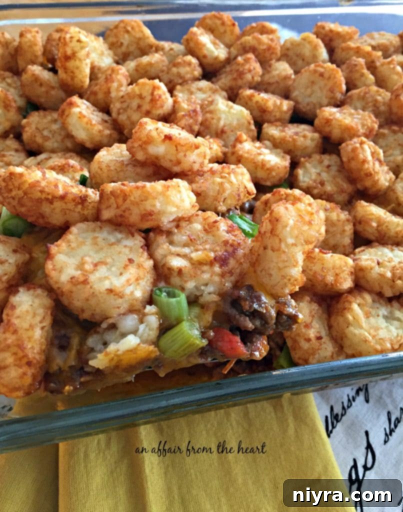 Loaded Tater Tot Taco Bake 10 Baked Taco Tot Casserole bubbling with golden brown crispy tater tots and melted cheese, fresh from the oven.