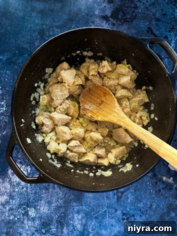 Step-by-step: Sautéing onions, garlic, and chicken for soup