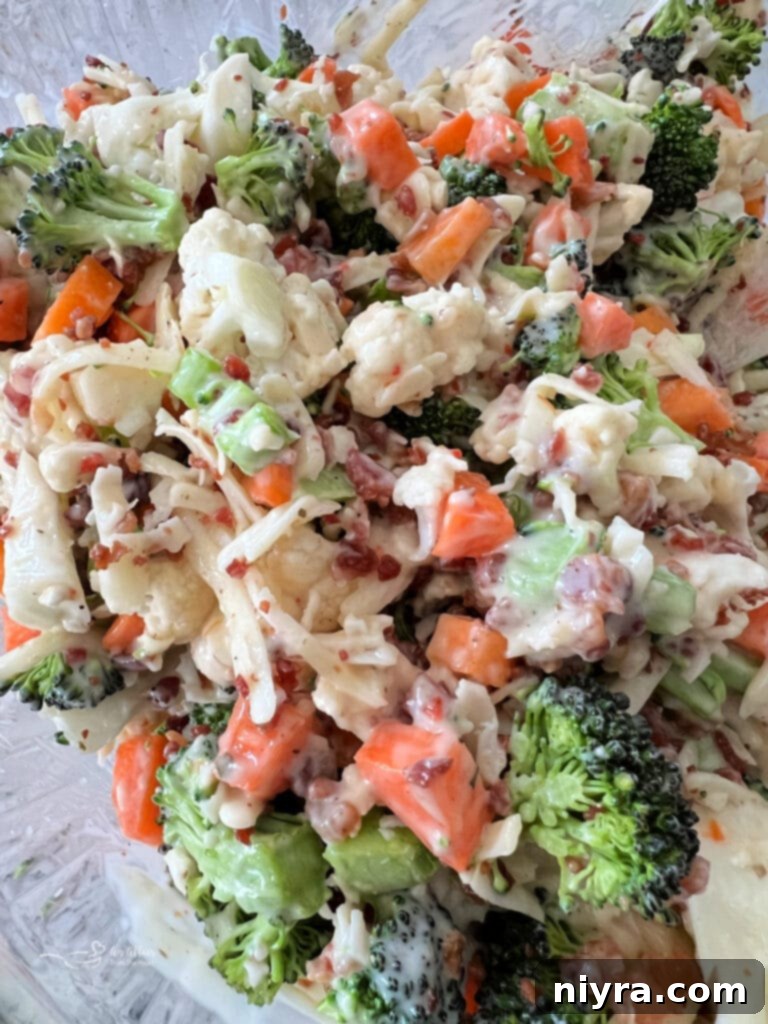 A vibrant raw vegetable salad with a light dressing.