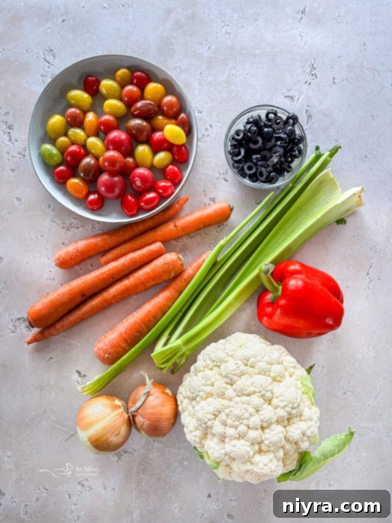 Close-up of marinated vegetables, highlighting fresh tomatoes and bell peppers.