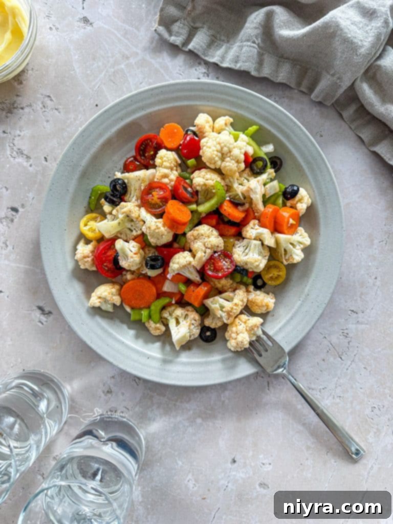 A close-up of the sweet marinade being poured over a bowl of chopped vegetables.