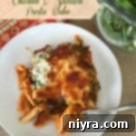 Overhead of Chicken & Spinach Pasta Bake on a white plate