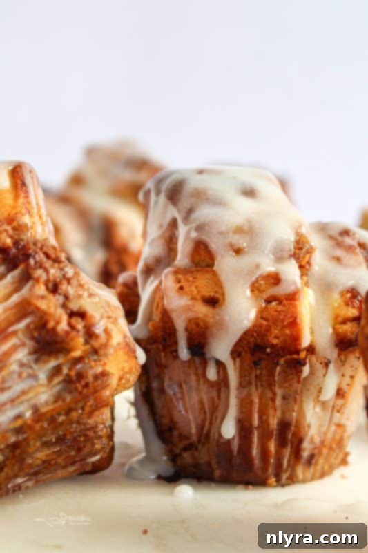 Delicious Toffee Monkey Bread Muffins, fresh from the oven, with a sticky, golden-brown crust and visible toffee bits.
