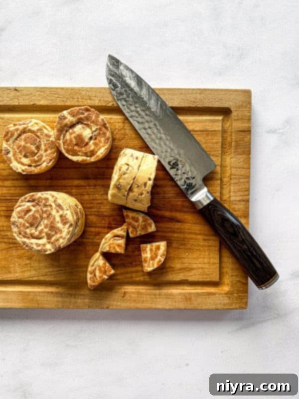 Pillsbury cinnamon rolls cut into quarters, ready for the muffin tin.
