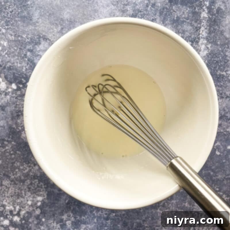 Reuben Chowder 7 Removing the bay leaf from the simmering soup.