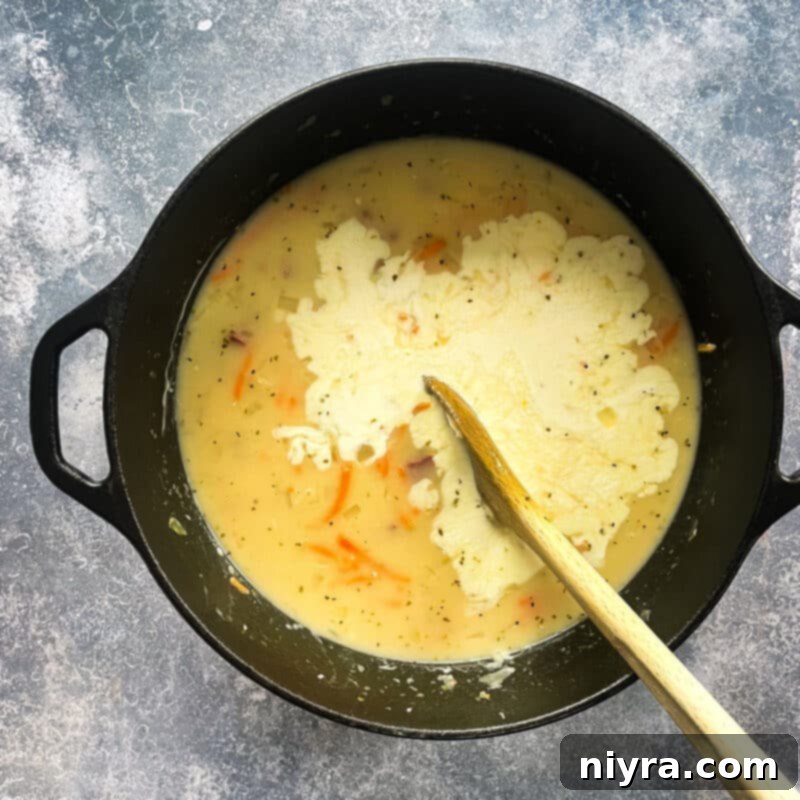 Reuben Chowder 9 Stirring heavy cream into the creamy Reuben soup.