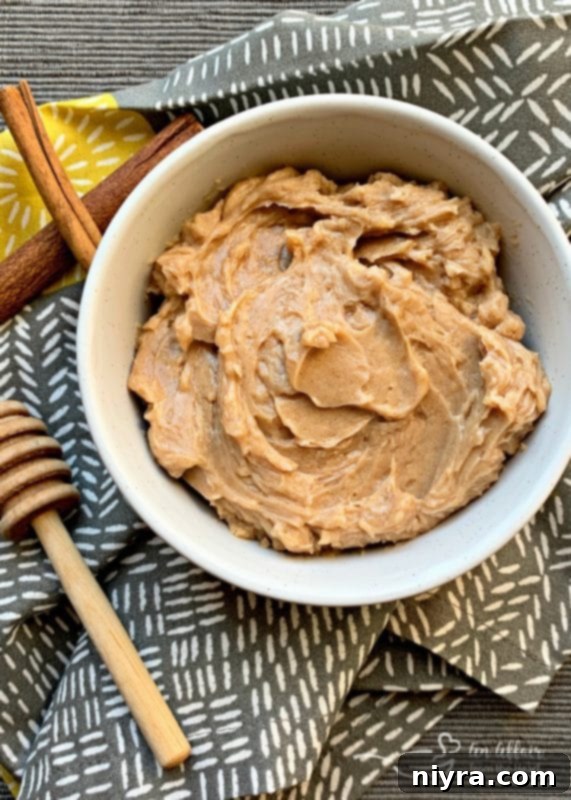 Close-up of freshly whipped cinnamon honey butter in a bowl, ready to be served.