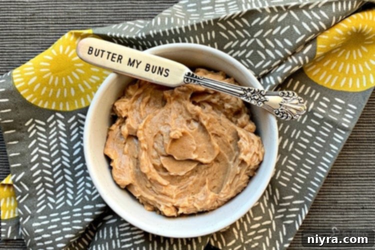 Homemade Texas Roadhouse Cinnamon Honey Butter in a serving dish, ready for rolls.