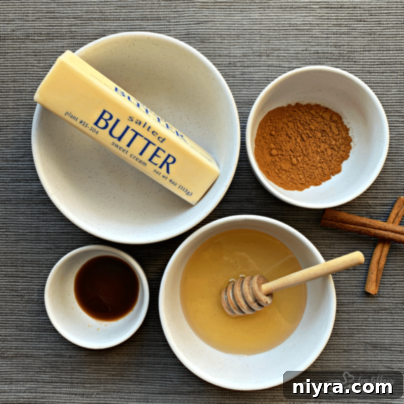 Softened butter, cinnamon, honey, and vanilla combined in a mixing bowl.
