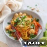 Pad Thai Wonderpot in a bowl with chops sticks leaning on the bowl.