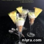 Side view of shooters with text "Pina Colada Cheesecake Shooters"