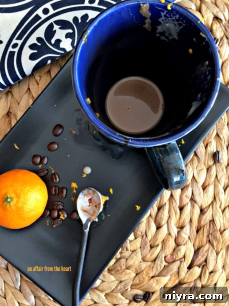 Golden Hour Mocha 9 Empty Orange Mocha Latte glass, signifying a delicious, finished drink