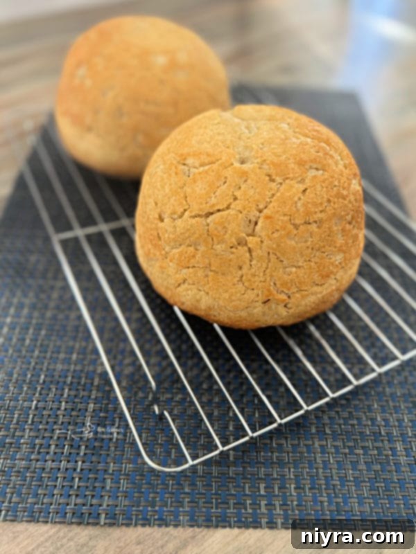 two loaves of peasant bread cooling on wire rack