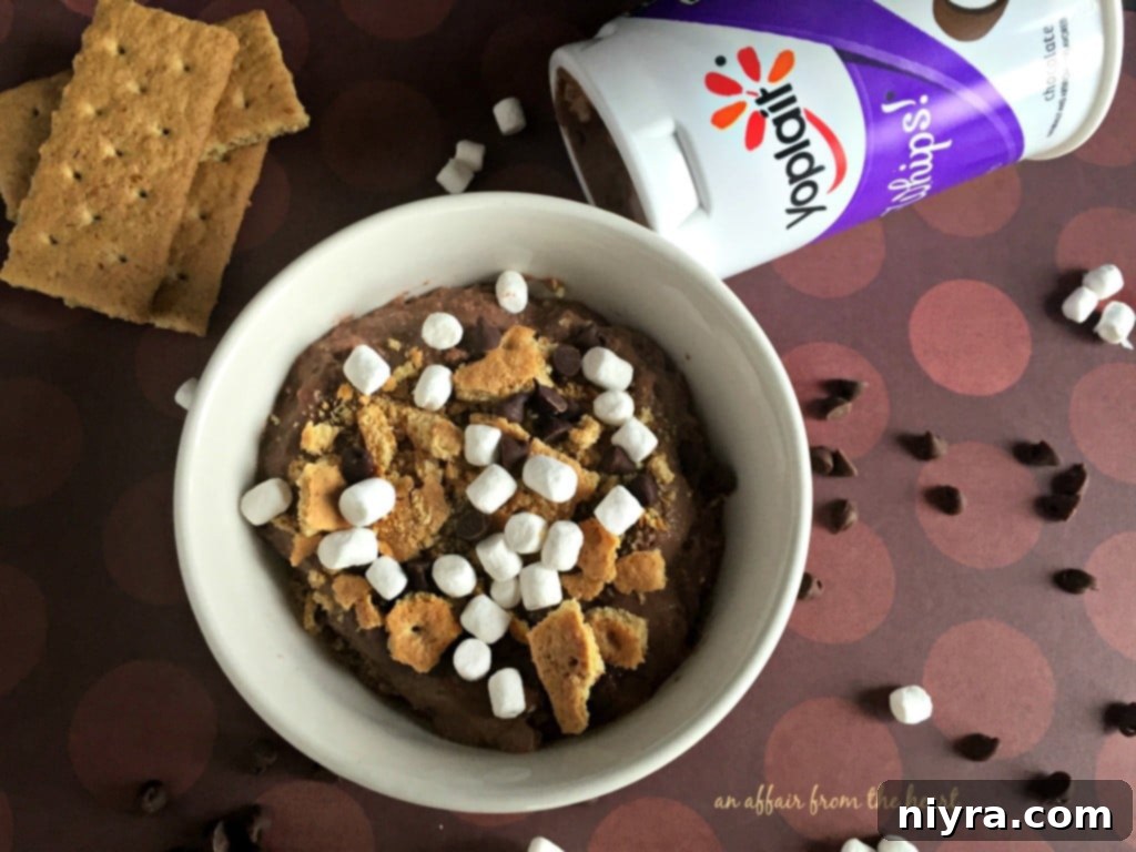 A cup of Yoplait Light Very Vanilla Yogurt, ready to be transformed into a S'Mores treat.