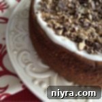 Cheesecake on a cake plate with text "Coffee Toffee Cheesecake"
