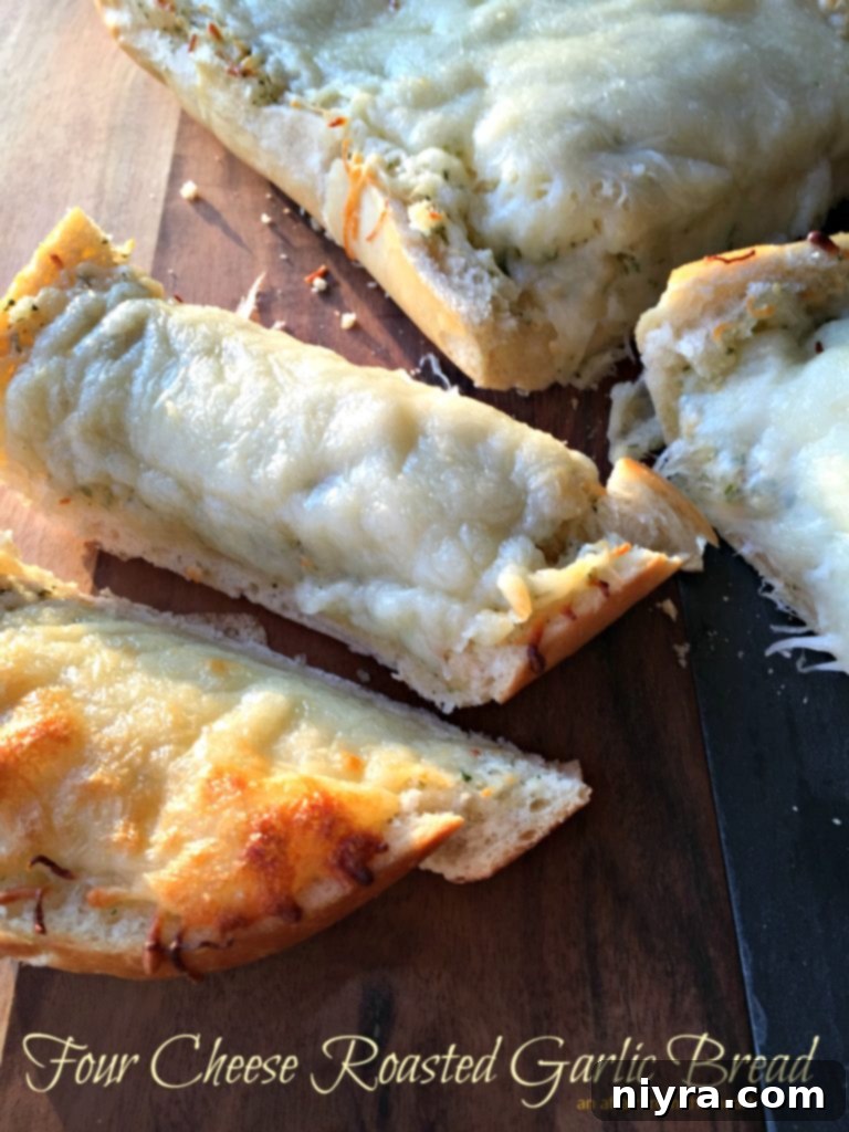 Close-up of golden brown, gooey four cheese roasted garlic bread