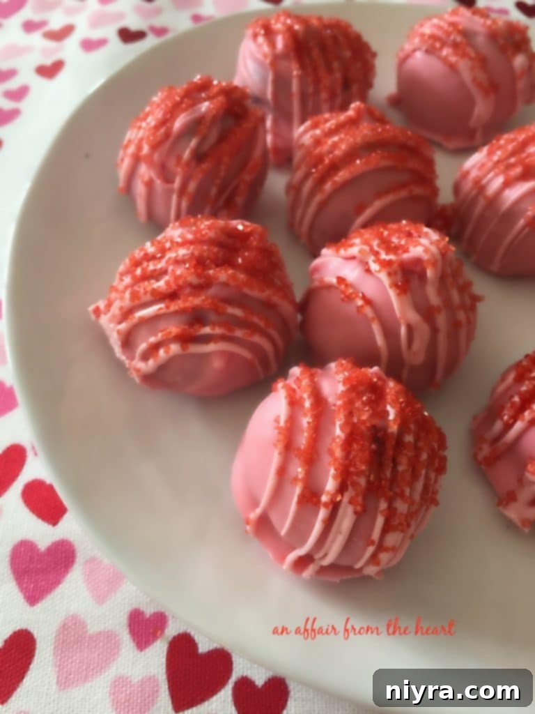 Oreo Truffles arranged in a heart shape, adorned with pink and red sprinkles