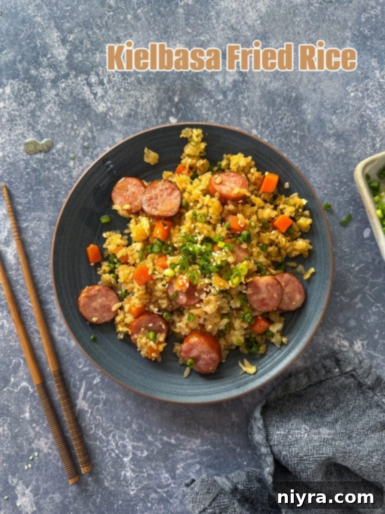 A serving of Kielbasa Fried Rice in a small white bowl.