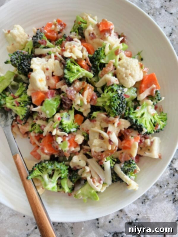 Pegs Fresh Italian Vegetable Salad 2 Close-up of Peg's Italian Summer Salad with vibrant cauliflower, broccoli, carrots, mozzarella, and bacon